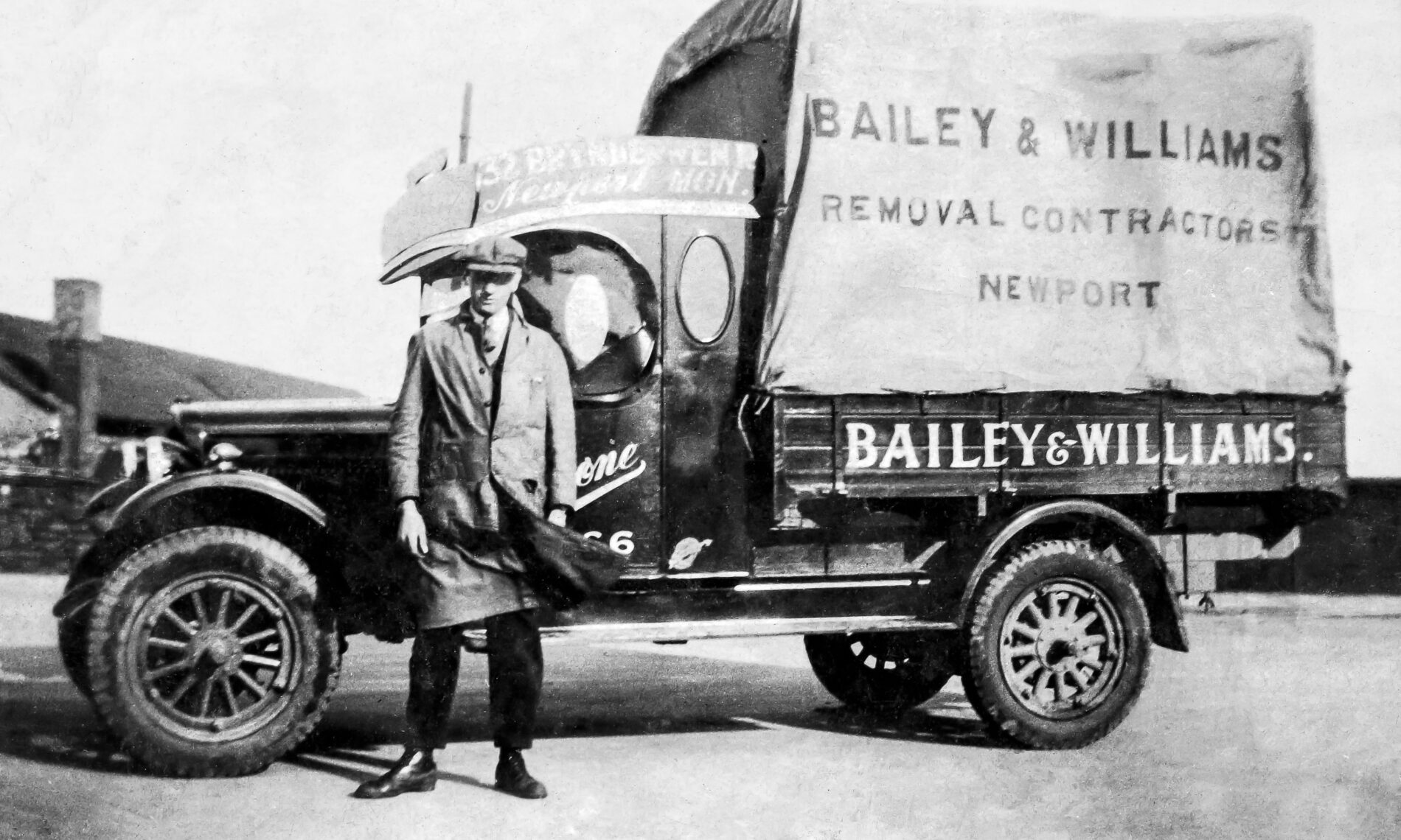 cecil bailey in front of a historic bailey and williams removals van
