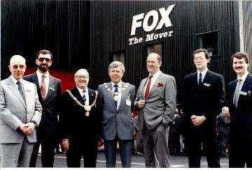 b.a.r. officials and fox officials outside a fox the mover premises