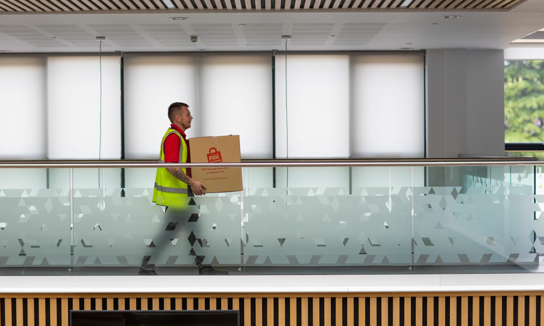 fox removals expert moving boxes during an office clearance