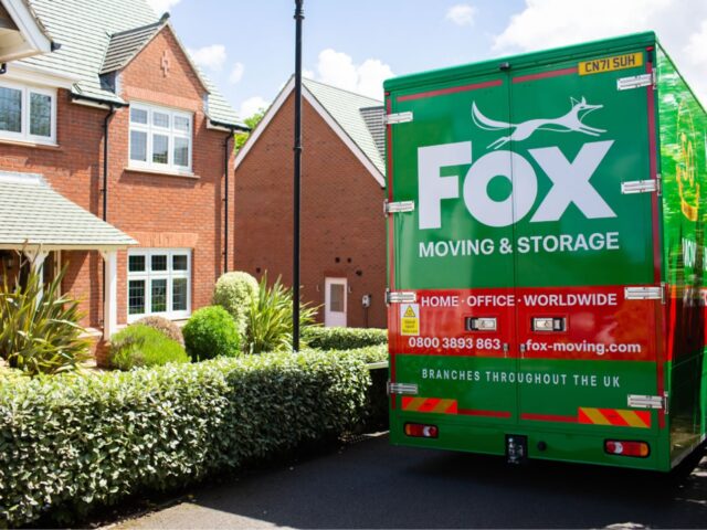 fox moving and storage van outside a house