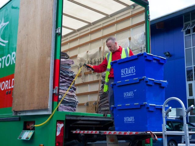 loading crates onto a fox moving van