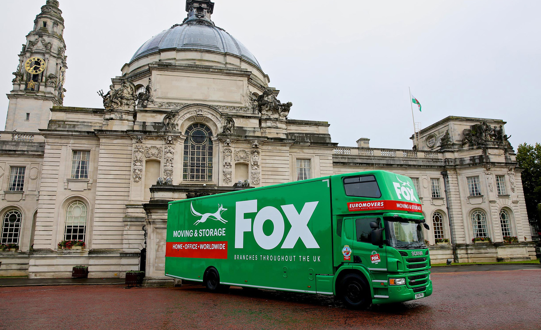 fox moving and storage van outside a heritage building