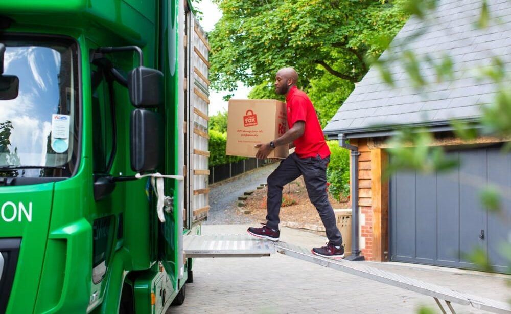 fox moving and storage mover loading a van